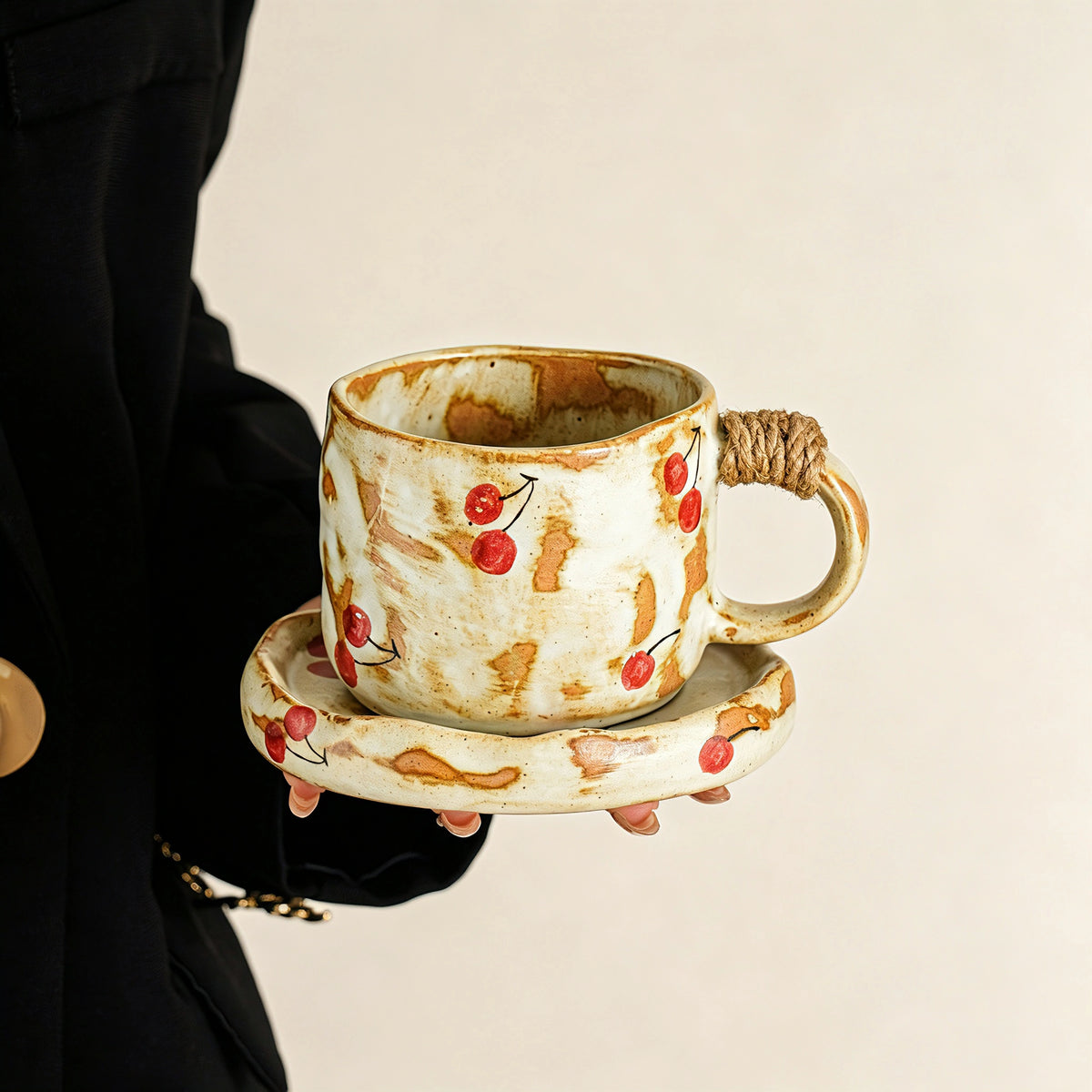 These vintage kiln‑change ceramic mugs feature unique dripping glaze rims and textured hand‑thrown bodies. The handles are wrapped with natural jute rope, adding a rustic artisanal touch. Available in multiple charming colorways, they make lovely daily coffee and tea drinking sets.