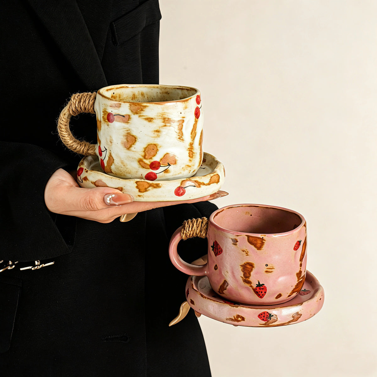 These vintage kiln‑change ceramic mugs feature unique dripping glaze rims and textured hand‑thrown bodies. The handles are wrapped with natural jute rope, adding a rustic artisanal touch. Available in multiple charming colorways, they make lovely daily coffee and tea drinking sets.