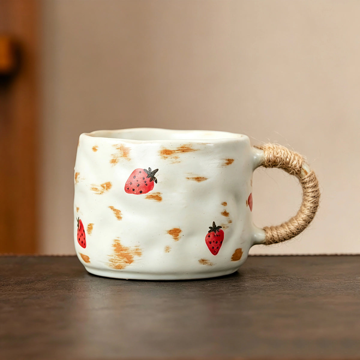 These vintage kiln‑change ceramic mugs feature unique dripping glaze rims and textured hand‑thrown bodies. The handles are wrapped with natural jute rope, adding a rustic artisanal touch. Available in multiple charming colorways, they make lovely daily coffee and tea drinking sets.