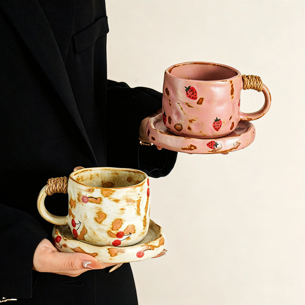 These vintage kiln‑change ceramic mugs feature unique dripping glaze rims and textured hand‑thrown bodies. The handles are wrapped with natural jute rope, adding a rustic artisanal touch. Available in multiple charming colorways, they make lovely daily coffee and tea drinking sets.