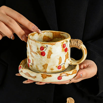 These vintage kiln‑change ceramic mugs feature unique dripping glaze rims and textured hand‑thrown bodies. The handles are wrapped with natural jute rope, adding a rustic artisanal touch. Available in multiple charming colorways, they make lovely daily coffee and tea drinking sets.